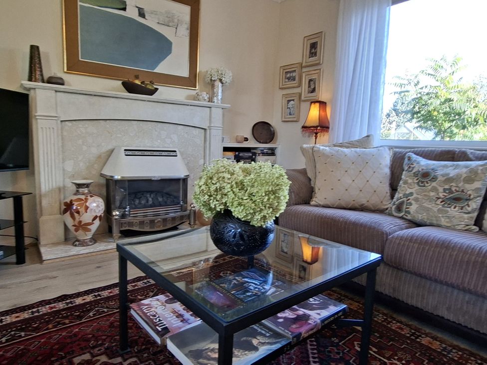A living room with a sofa and a coffee table at Apple Byrd in Kendal