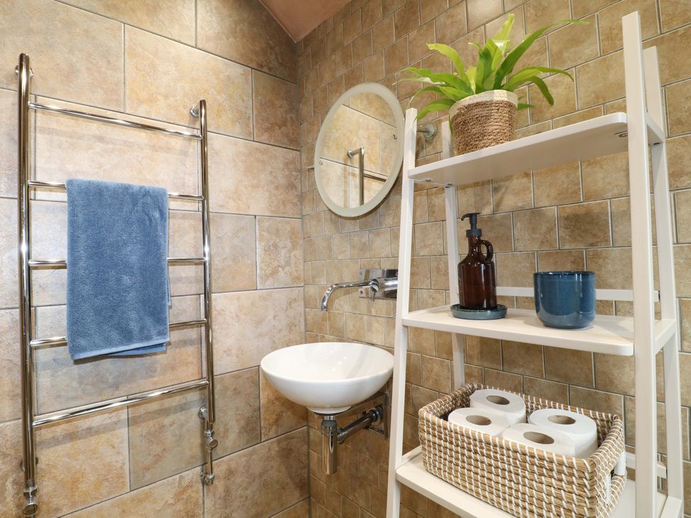 A bathroom with a towel rack and sink at 9 New Lumford