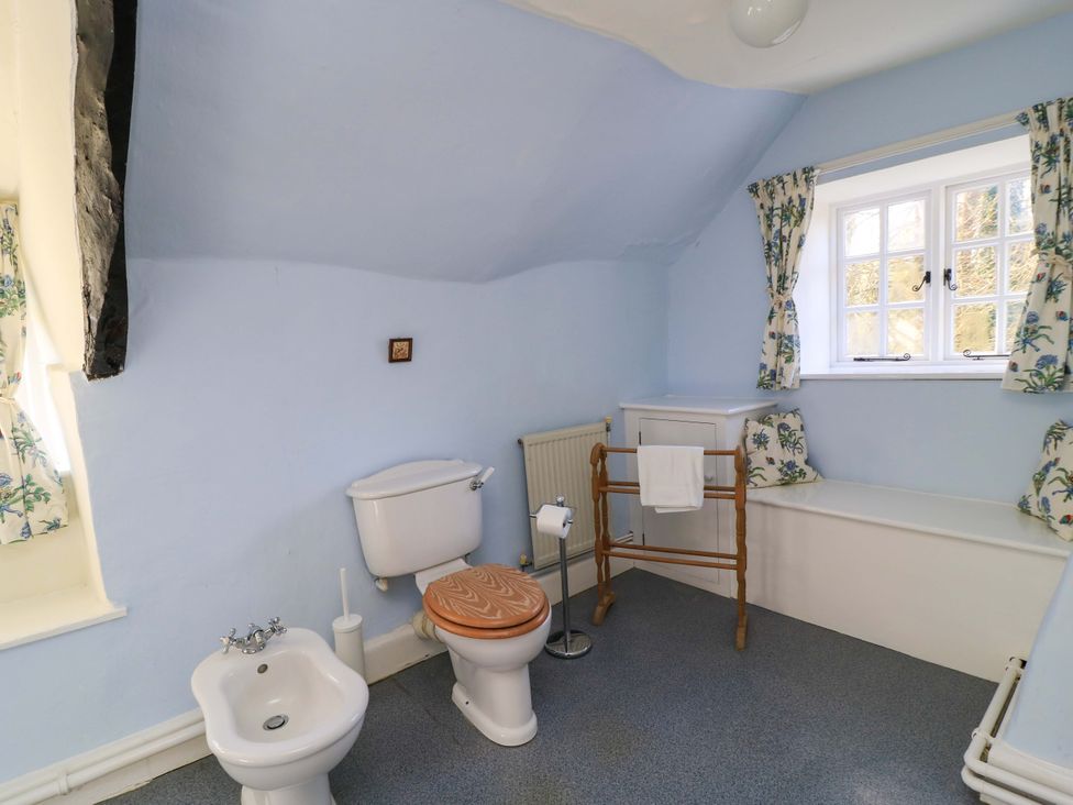 A bathroom with a toilet and bidet at Plush Cottage in Dorchester