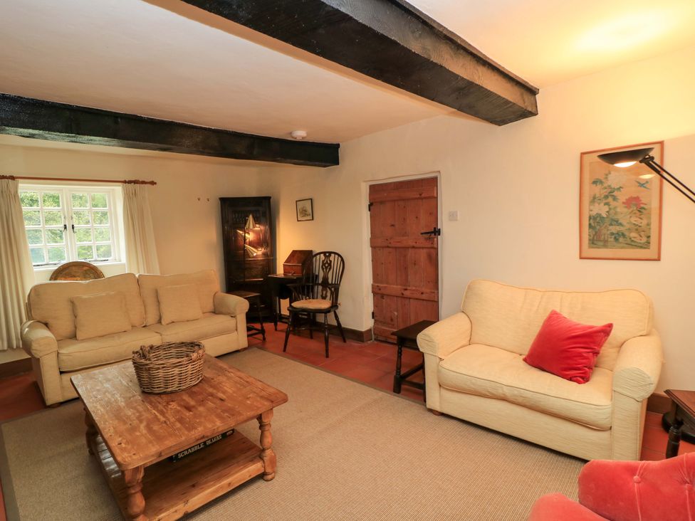A living room with sofas and a coffee table at Plush Cottage in Plush