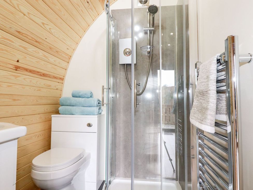 A bathroom with a shower and sink at Barry in Polgooth