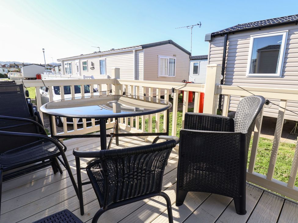 An outdoor seating area with a table and chairs at The Pad in 