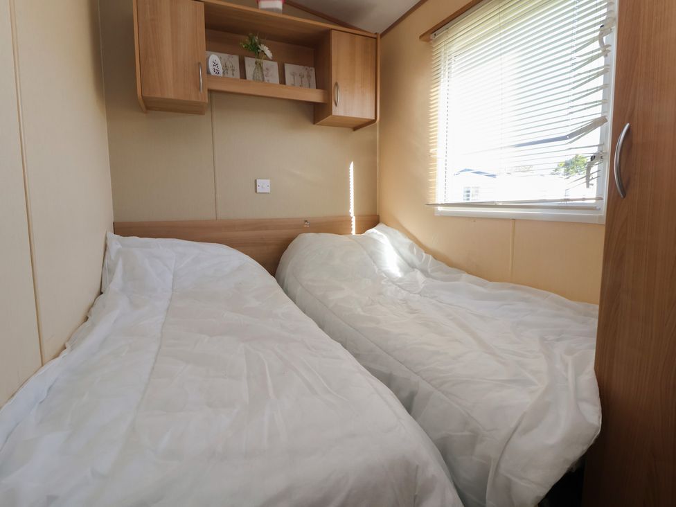 A bedroom with two beds and a window at The Pad in 