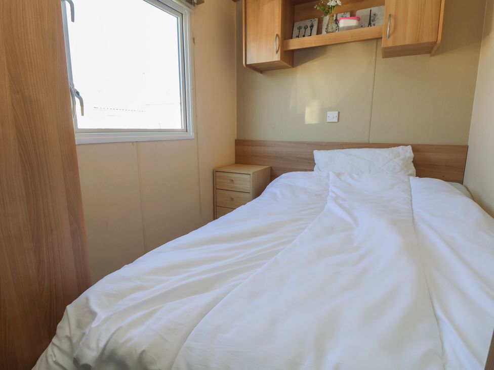 A bedroom with a bed and window at The Pad 