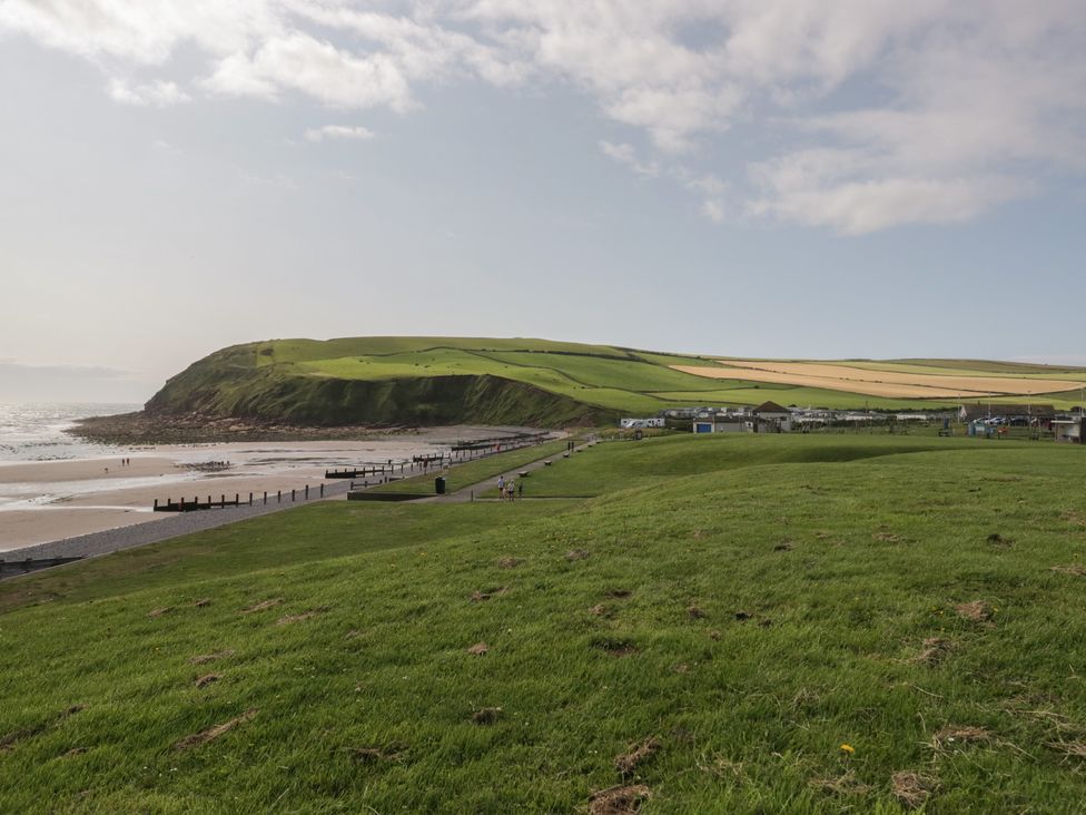 A coastal view with beach and grassy area at Mobility Friendly Caravan in St Bees