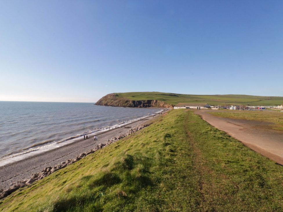 A coastal view with a beach and cliff at Guillemot St Bees
