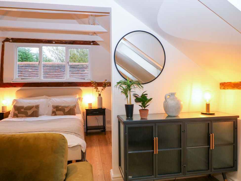 A bedroom with a bed and plants at Annex in North Chailey near Newick