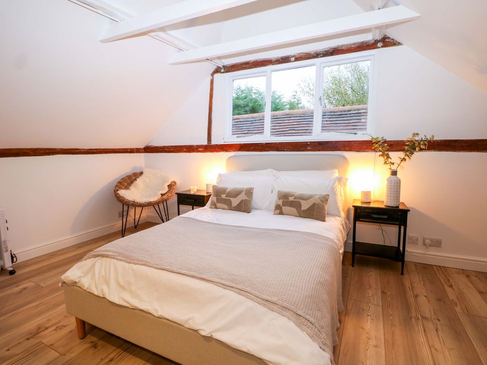 A bedroom featuring a bed and bedside tables at Annex in North Chailey near Newick