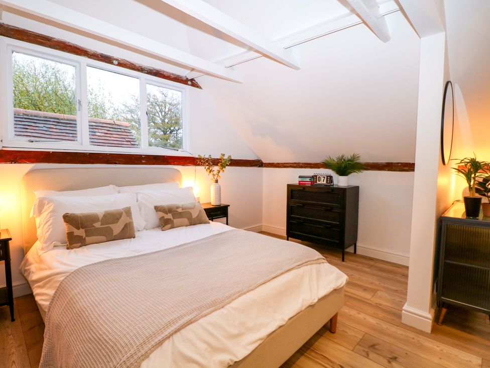 A bedroom with a bed and nightstand at Annex in North Chailey near Newick