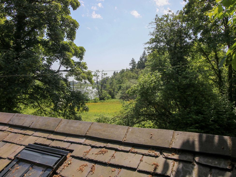 View of trees and field from a roof at The Lime Kiln Keepers Cottage in Ellesmere