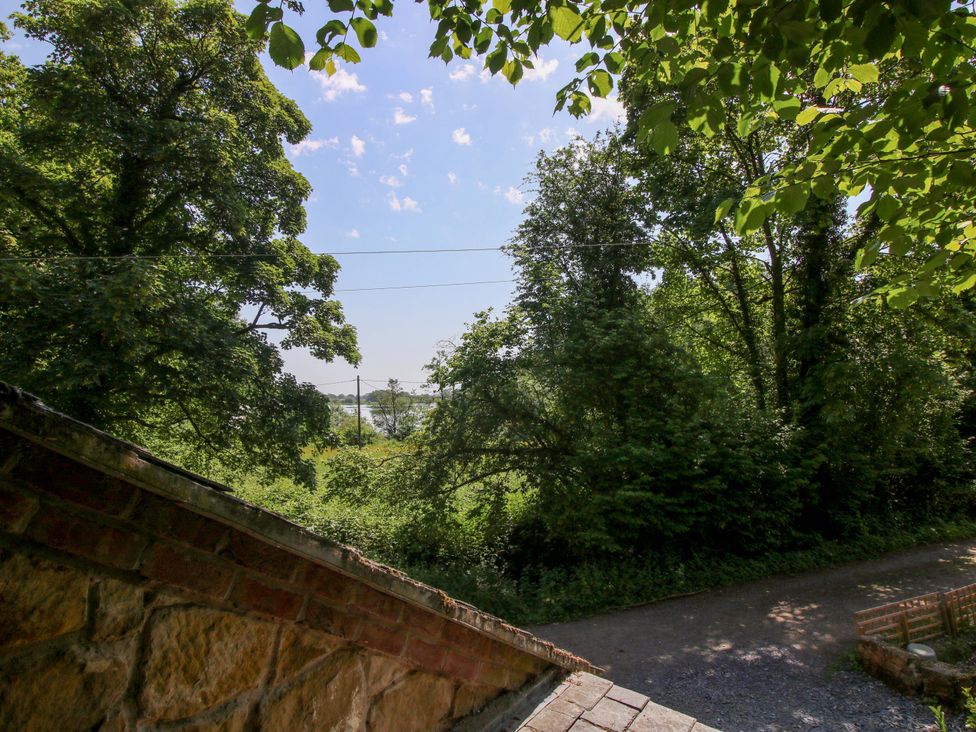View of trees and sky from a property at The Lime Kiln Keepers Cottage in Ellesmere