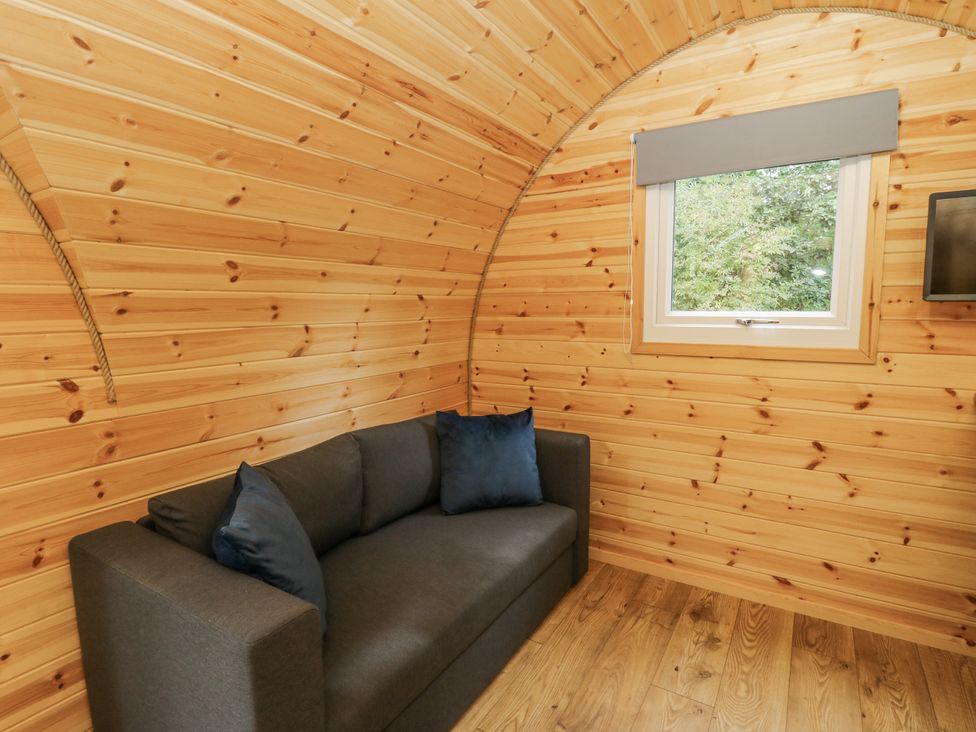 A room with a sofa and window at Oak View Rhayader