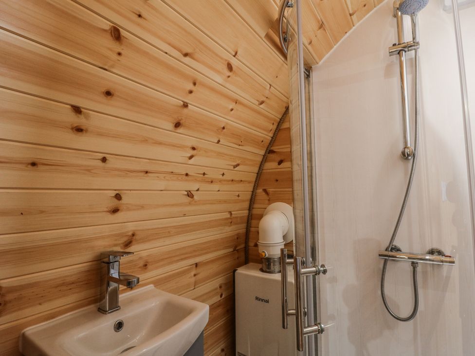 A bathroom with a sink and shower at Oak View Rhayader