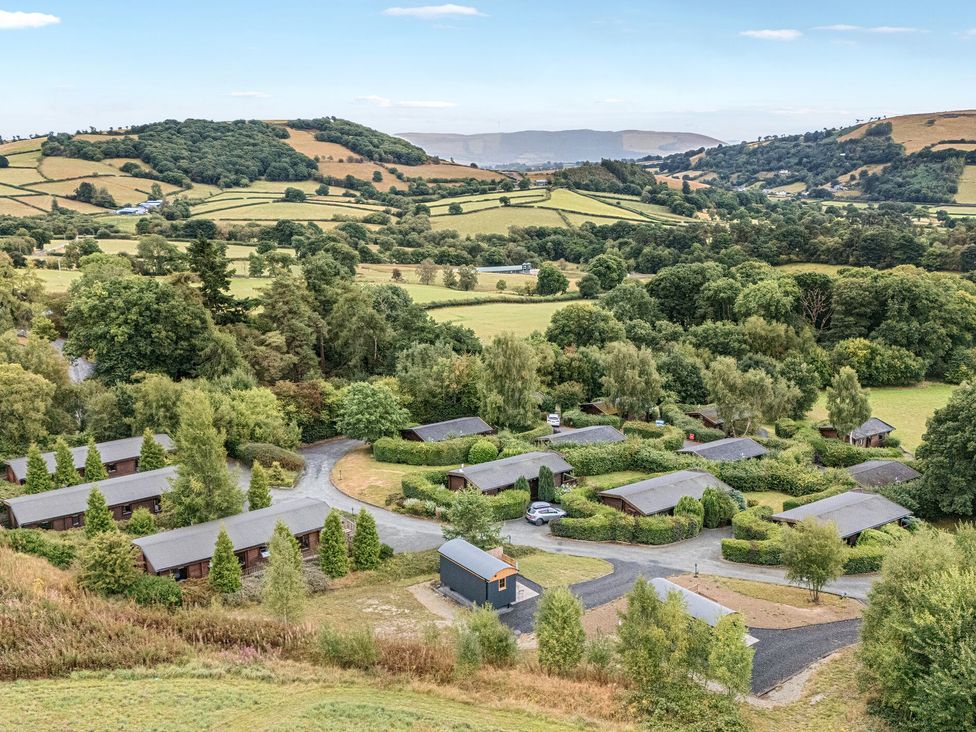 An aerial view of cabins and greenery at Oak View in Rhayader