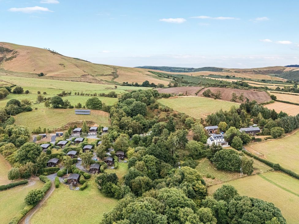 An aerial view of cabins and landscape at Oak View in Rhayader