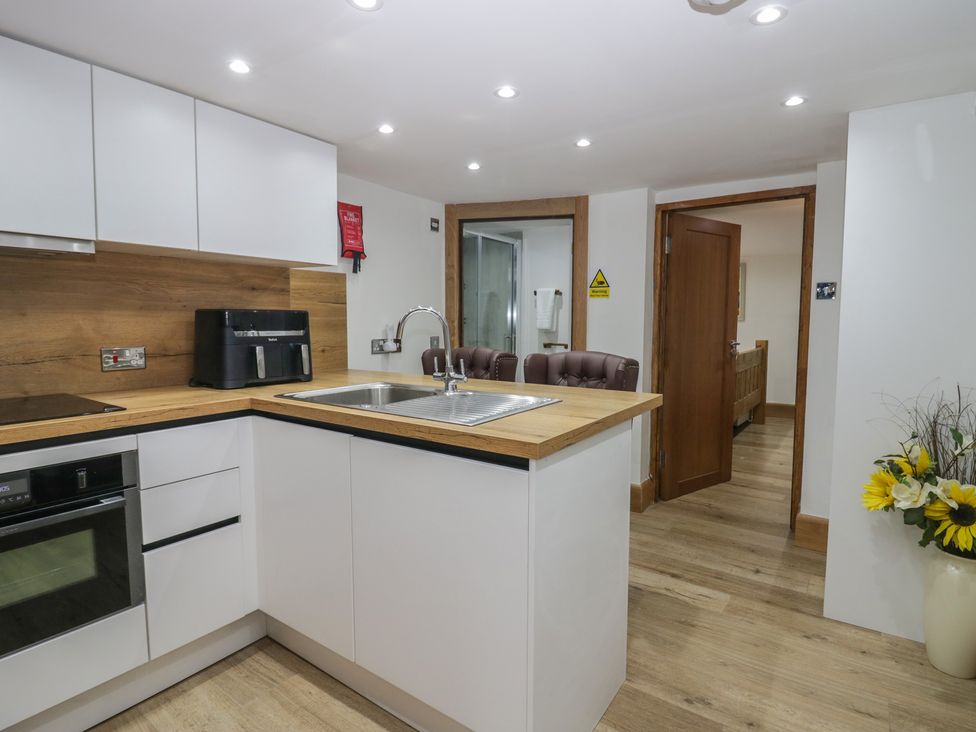 A kitchen with a sink and appliances at Park View Studio in Ambleside