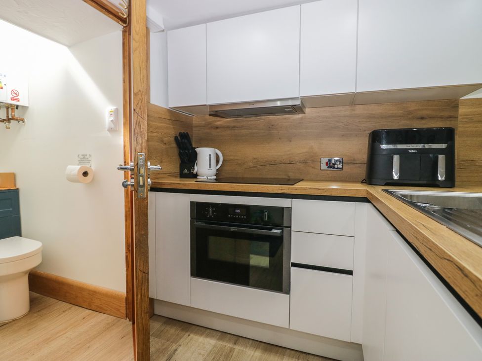 A kitchen with an oven and kettle at Park View Studio in Ambleside