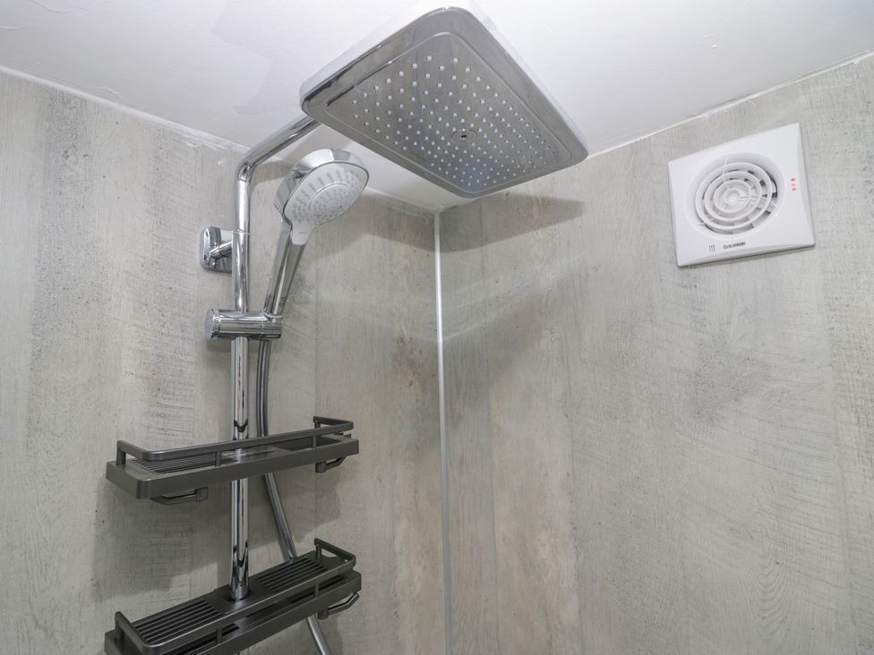 A shower with a rain showerhead at Park View Studio in Ambleside