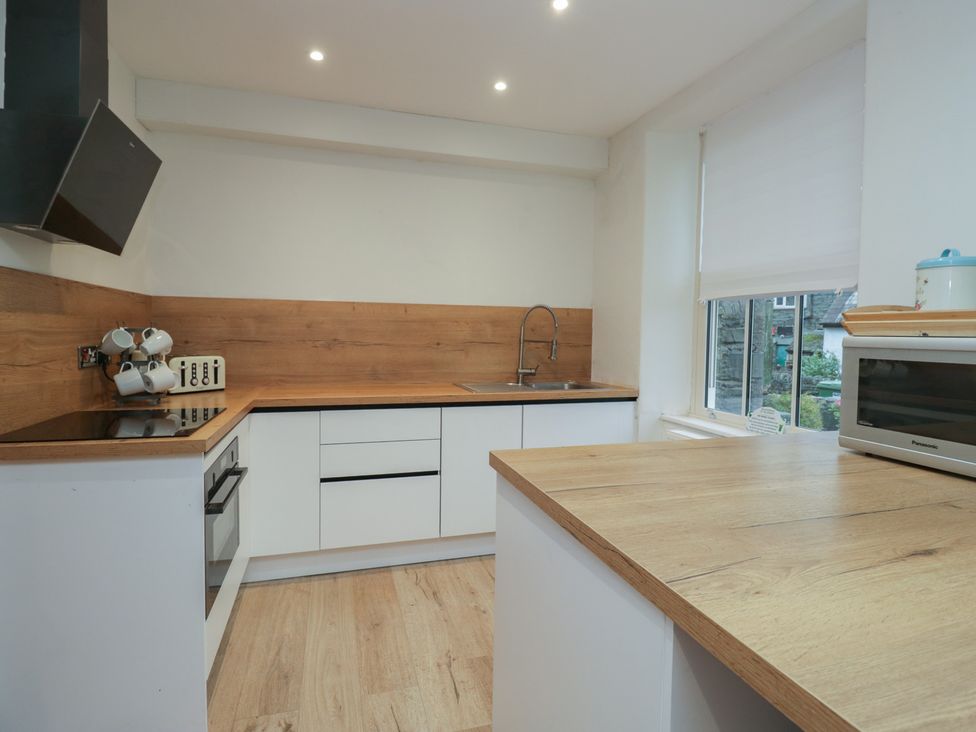 A kitchen with a sink and stove at Park View in Ambleside