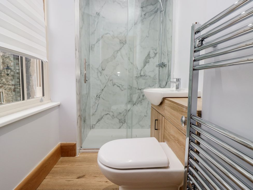 A bathroom with toilet, sink, and shower at Park View in Ambleside