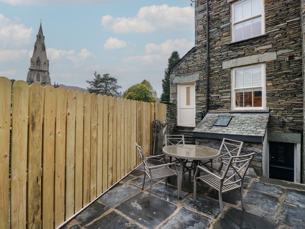 An outdoor seating area with a table and chairs at Park View in Ambleside
