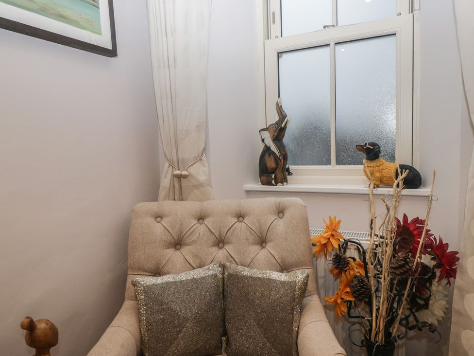 A snug with an armchair and decorative elements at Park View in Ambleside