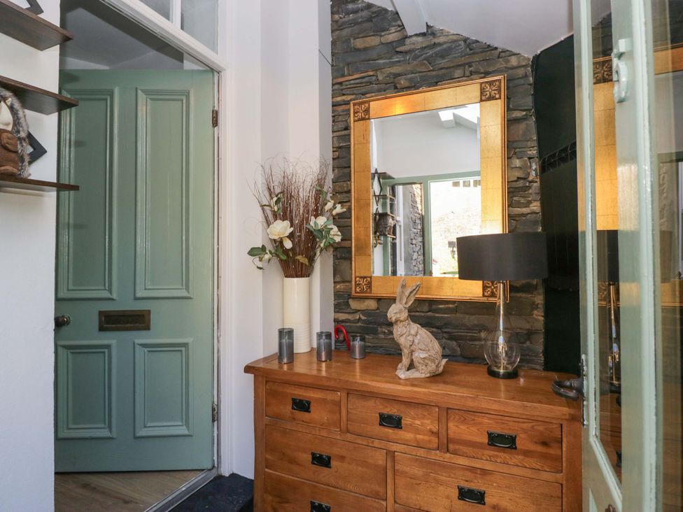 An entryway with a door and chest of drawers at Park View in Ambleside