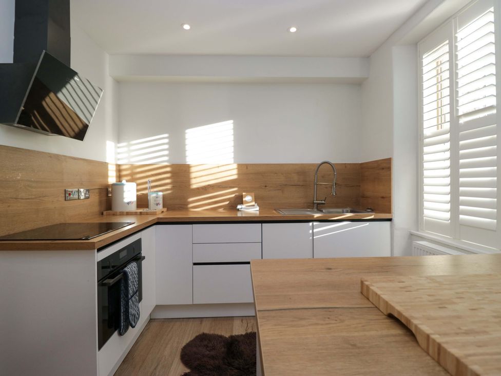 A kitchen with a sink and stove at Park View in Ambleside