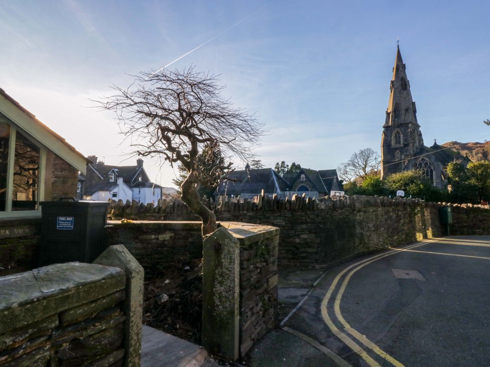 A street view featuring a church and a tree at Park View in Ambleside