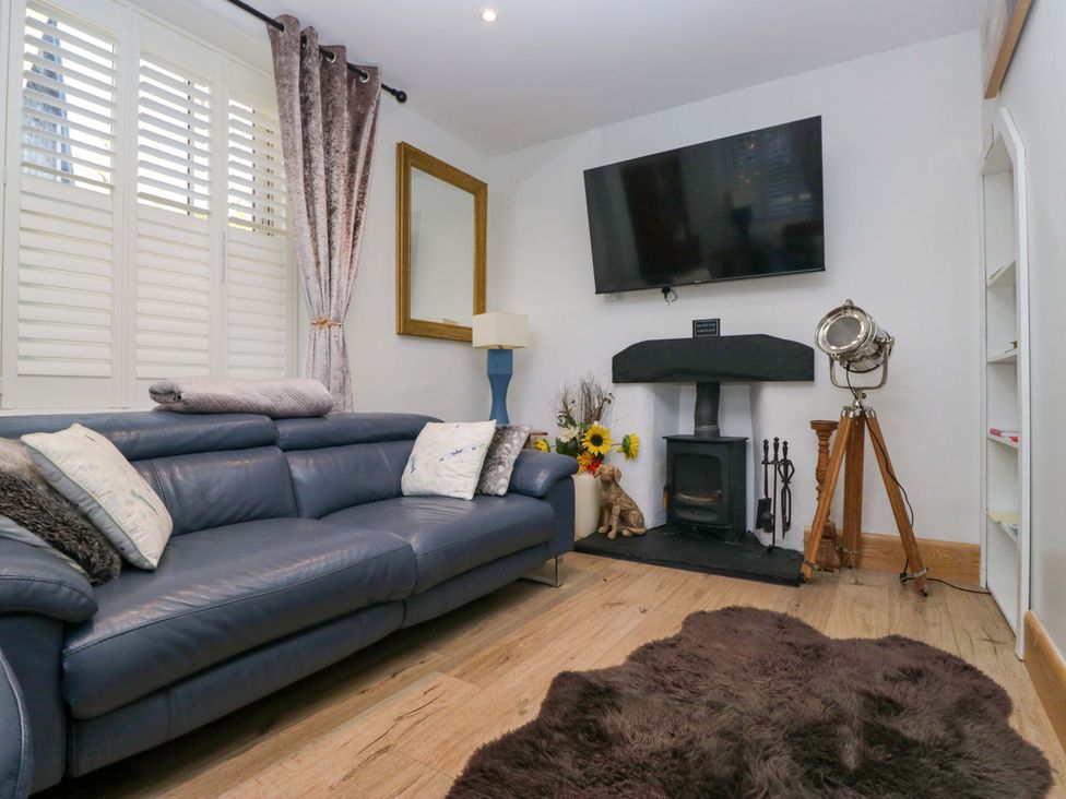A living room with a sofa and television at Park View in Ambleside