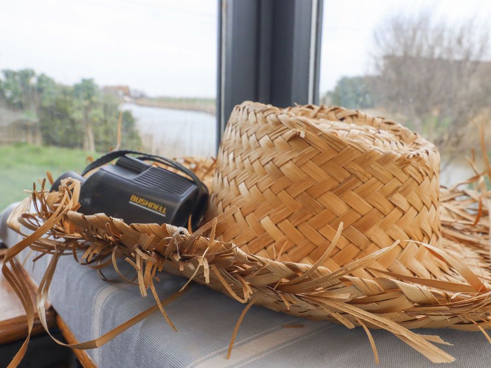 A straw hat and a locator on a table at Greengates in Rye