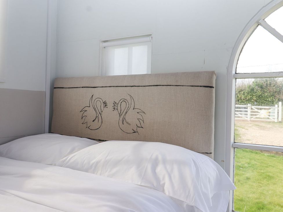 A bedroom with a bed and window at Greengates in Rye