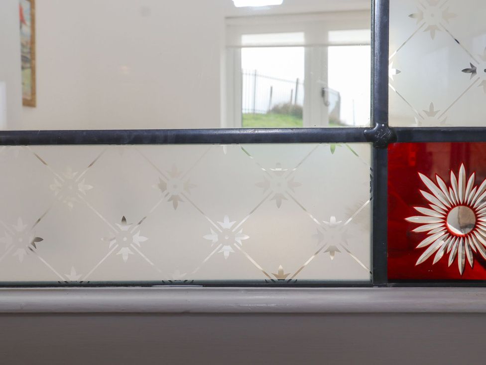 A decorative glass panel in a room at Greengates Rye
