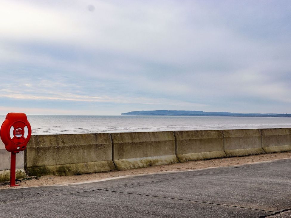 A view of the sea with a lifebuoy at Greengates in Rye