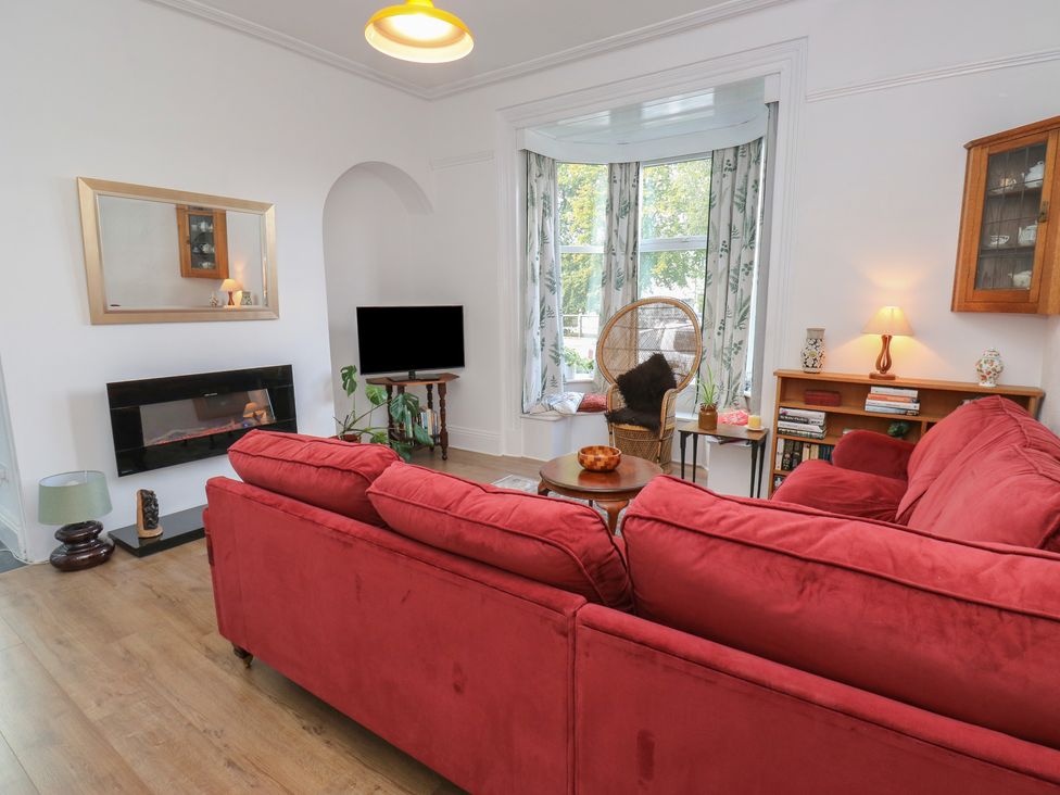 A living room with a sofa and coffee table at 27 Calton terrace in Skipton