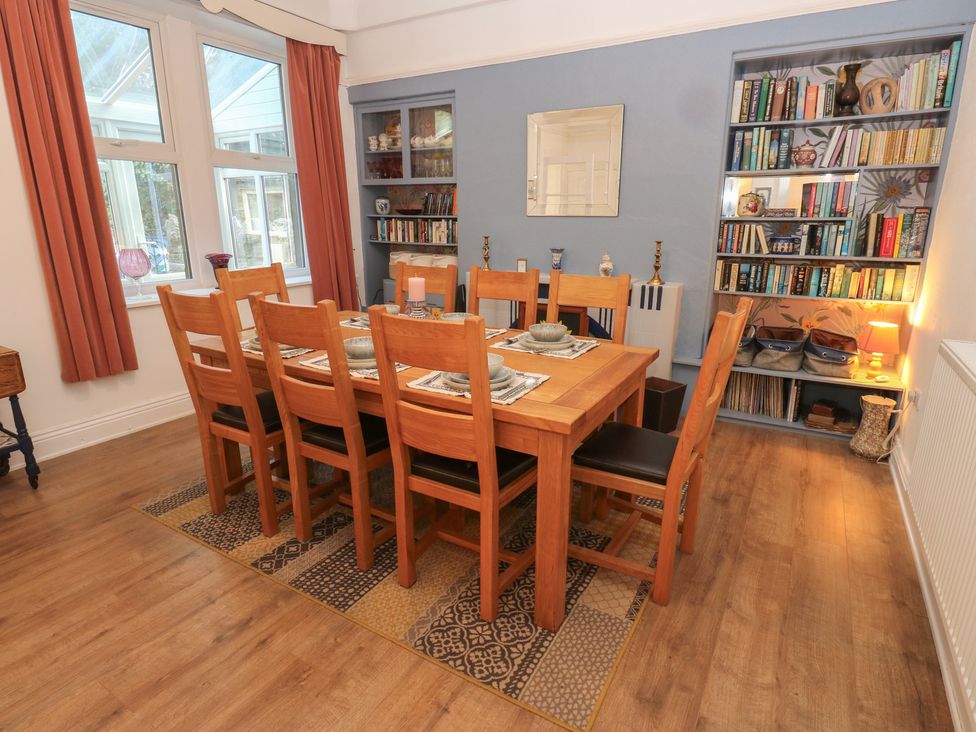 A dining room with a table and chairs at 27 Calton terrace Skipton