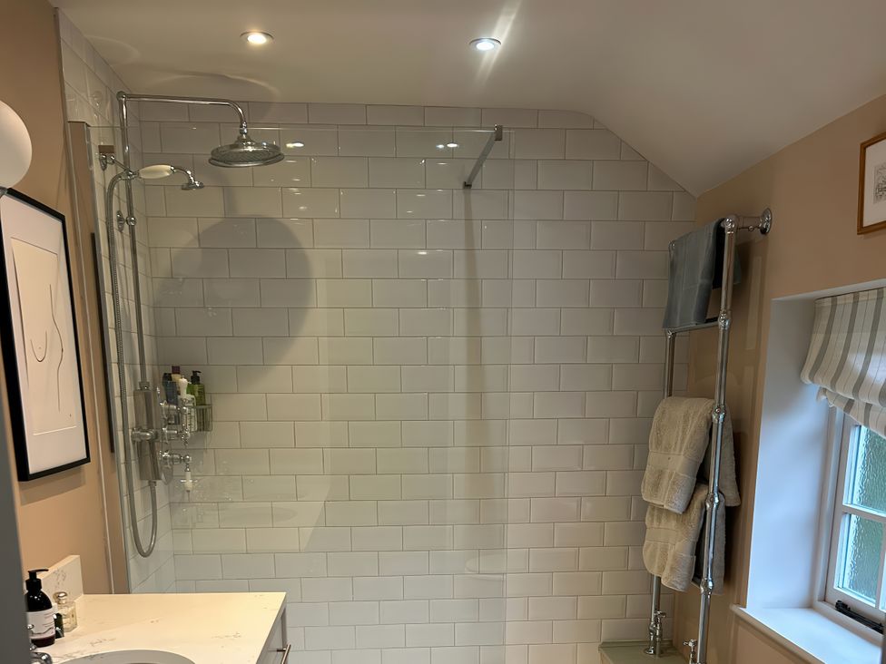 A bathroom with a shower and sink at Riverside Cottage