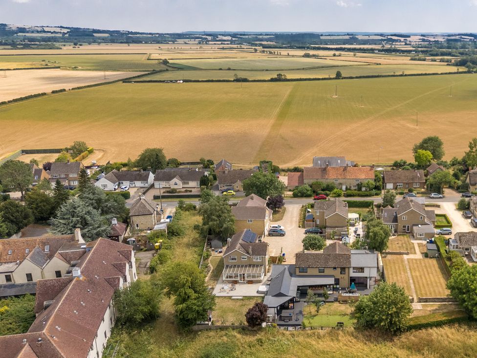 An aerial view of houses and fields at Manor Farm House in Merton near Bicester