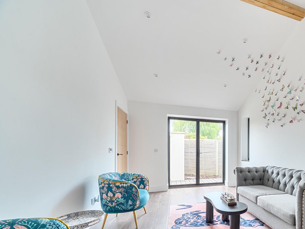 A living room with a sofa and chairs at Manor Farm House in Merton near Bicester