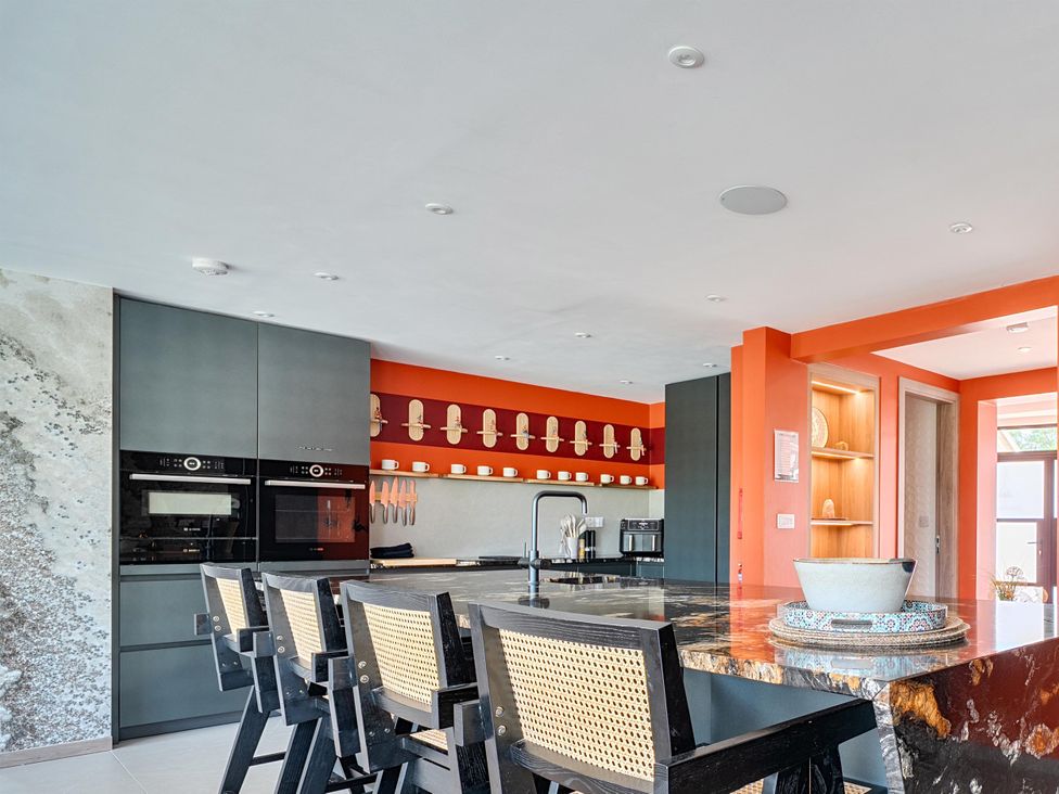 A kitchen with modern appliances and counter space at Manor Farm House in Merton near Bicester
