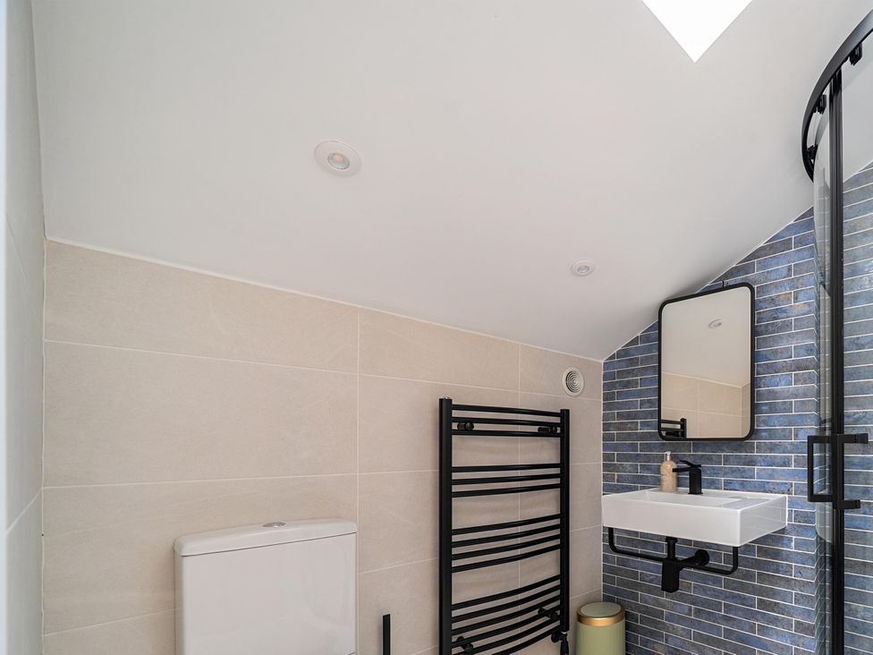 A bathroom with a sink and towel rail at Manor Farm House in Merton near Bicester