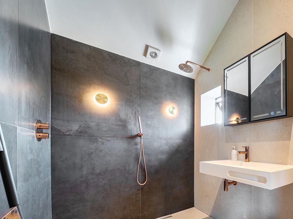 A bathroom with a shower and a sink at Manor Farm House in Merton near Bicester