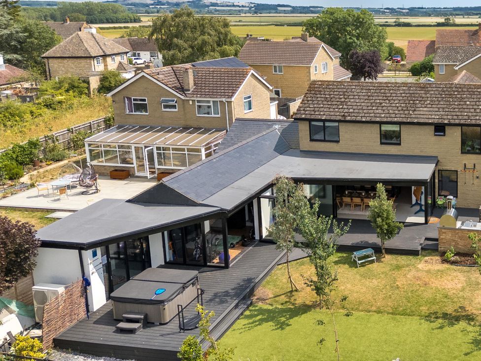 A house with a garden and deck at Manor Farm House Merton near Bicester