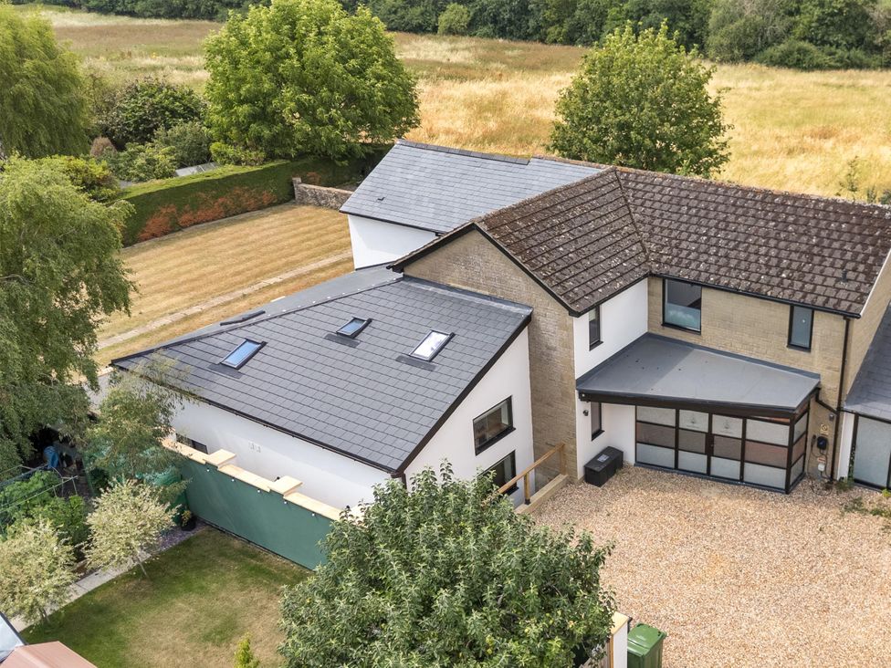 An aerial view of a house with a garden at Manor Farm House in Merton near Bicester