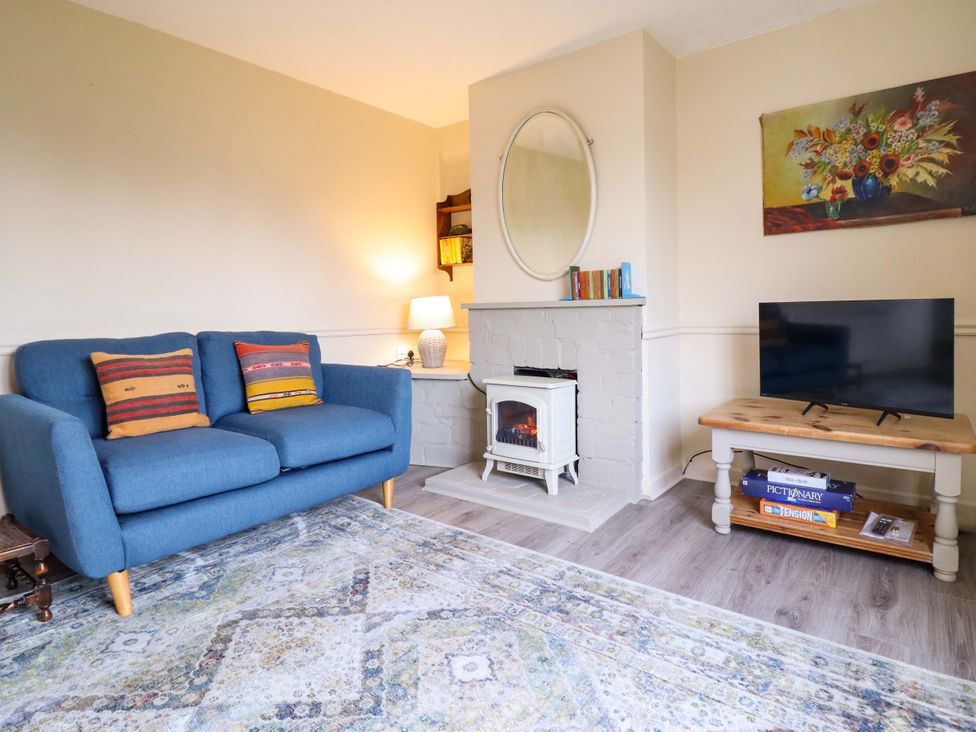 A living room with a sofa and fireplace at 2 Horseshoe Road in Montgomery