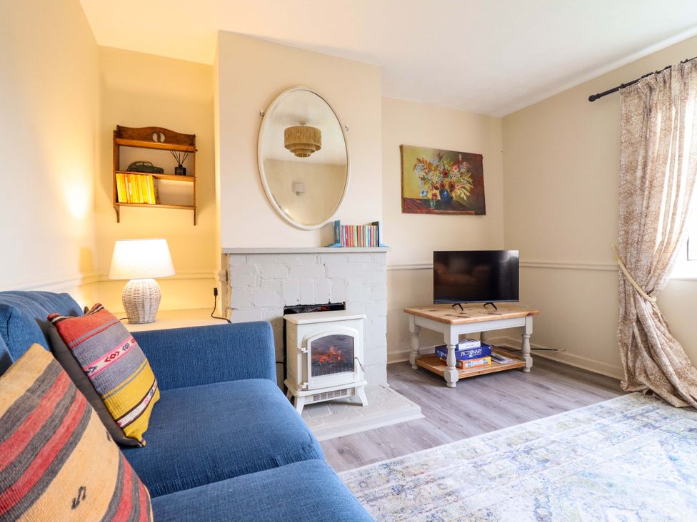 A living room with a television and a fireplace at 2 Horseshoe Road Montgomery