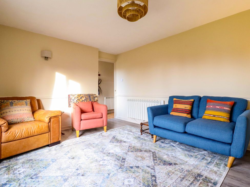 A living room with two sofas and a rug at 2 Horseshoe Road Montgomery