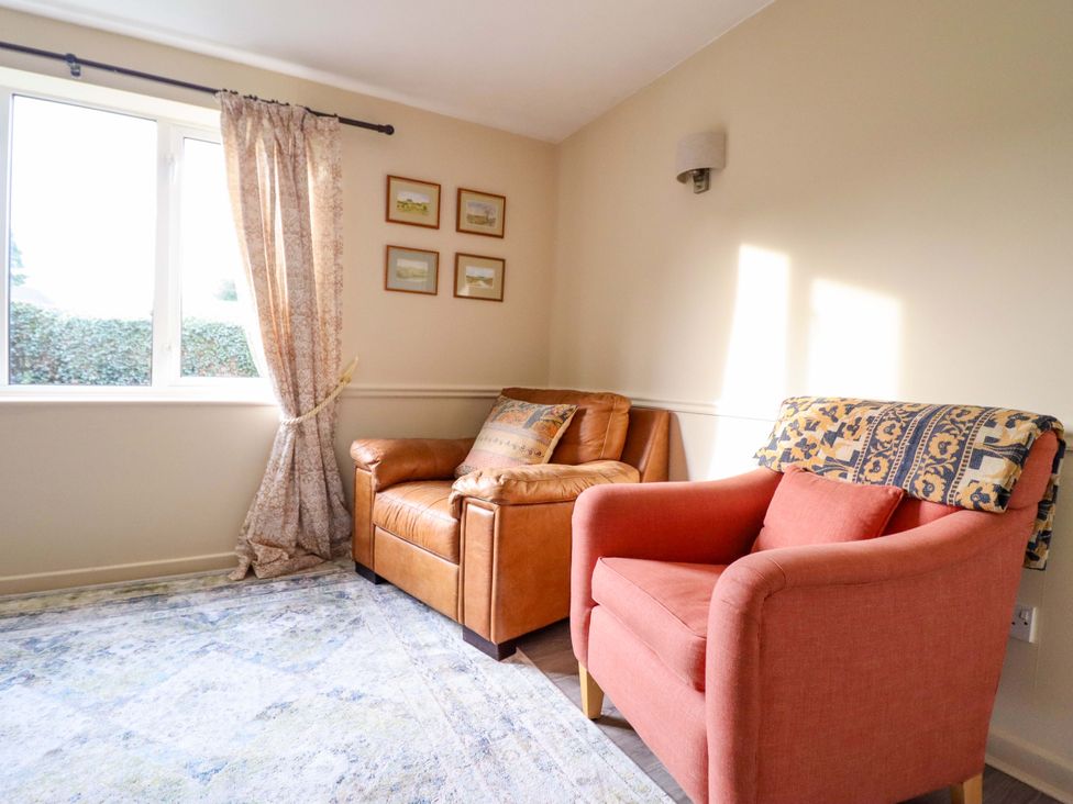 A living room with two chairs and a window at 2 Horseshoe Road in Montgomery