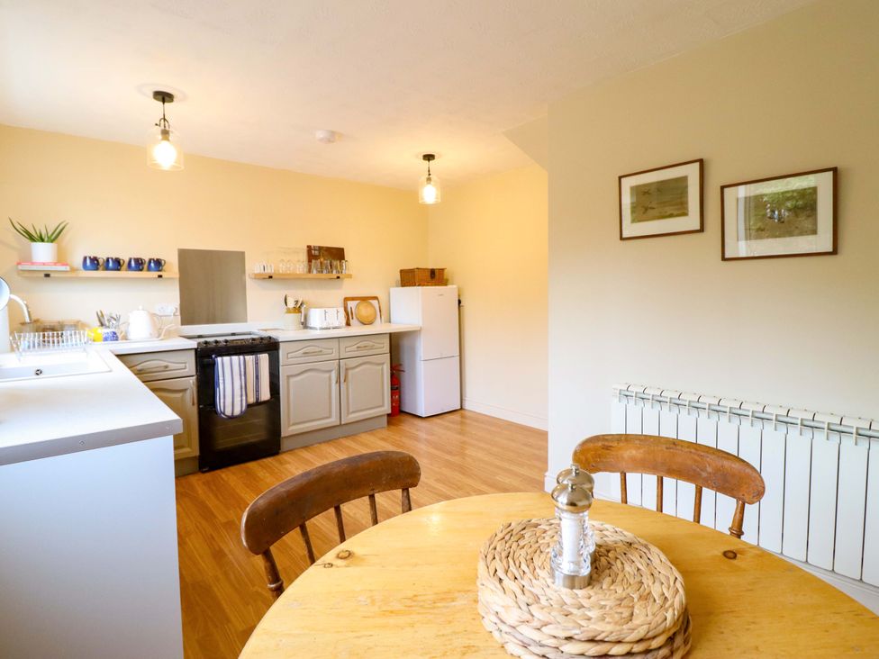 A kitchen with a dining table and chairs at 2 Horseshoe Road in Montgomery
