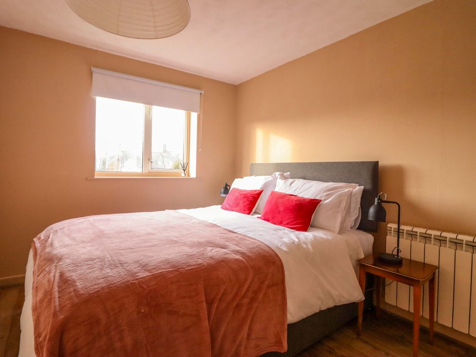 A bedroom with a bed and bedside table at 2 Horseshoe Road Montgomery